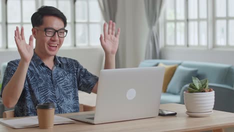 man with laptop computer having video call and working at home , video in 4k