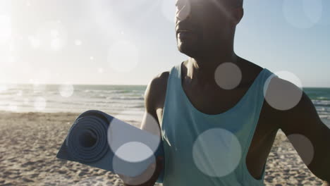 animation of glowing lights over an exercising african american man