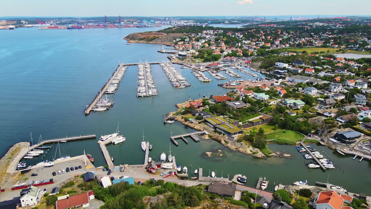 Scenic View Of Langedrag District Near The Marina With Moored Boats In Summer In Gothenburg, Sweden. - aerial drone shot
