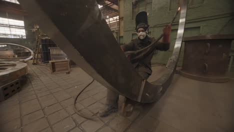 welding large metal structure in industrial setting