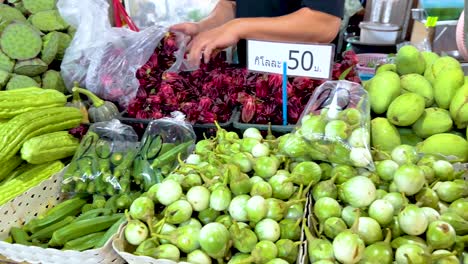 colorful local vegetables and fruits displayed at floating market stall