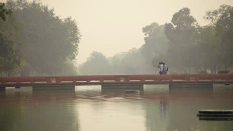 Indian-people-passing-a-bridge