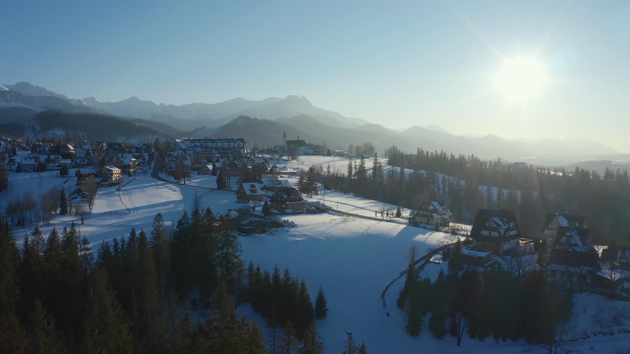 Podhale Panorama: Aerial Shot Capturing Cyrhla's Winter Charms with distant mountains