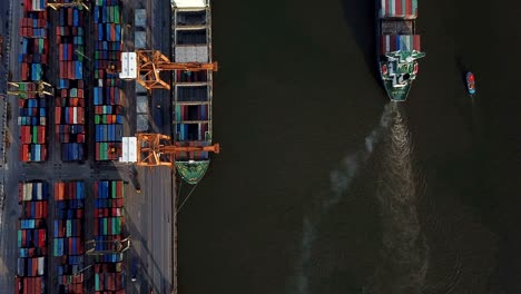 4k video : aerial view of working crane loading bridge in shipyard