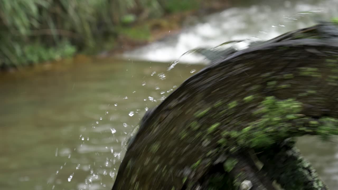 Spinning Wooden Water Mill Wheel Stream, Close Up, Slow Motion