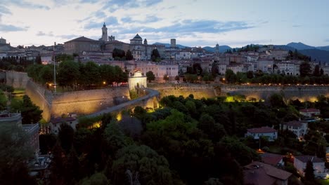 italy, bergamo alta at dusk general aerial vison lights on