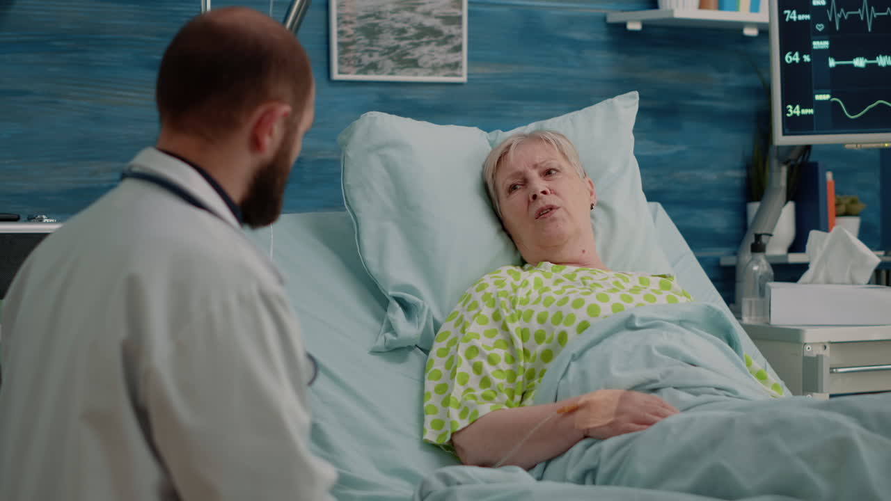 Doctor doing healthcare consultation with retired patient