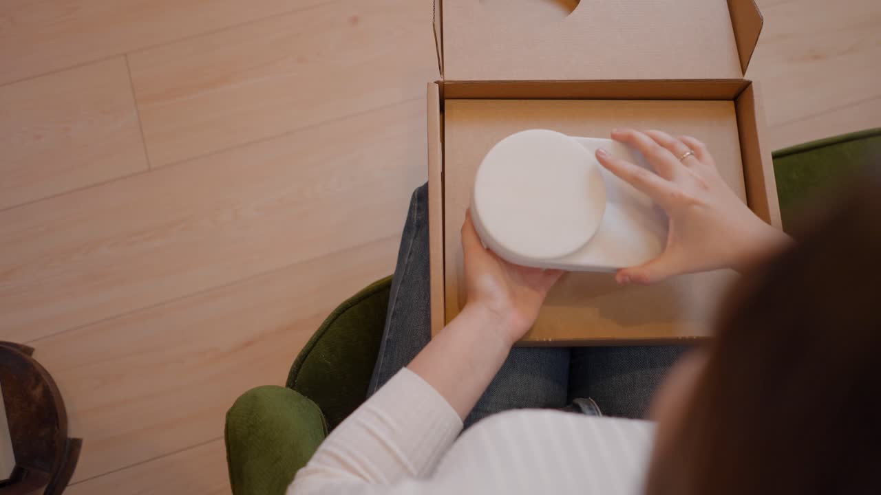 Unboxing a White Circular Object