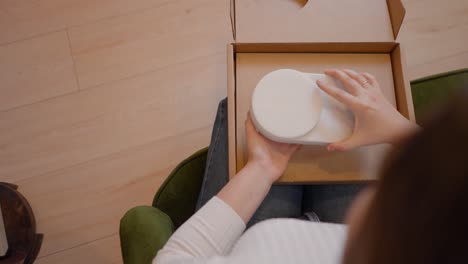 unboxing a white circular object