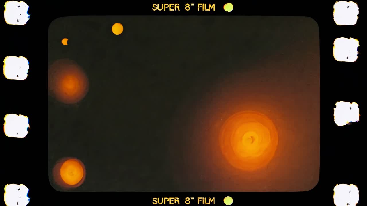 Retro video style with a vintage Super 8 film look, featuring a grainy texture and lens flare