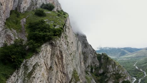 mountain cliffside landscape with fog