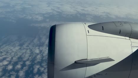 clouds and sky as seen through window of an aircraft