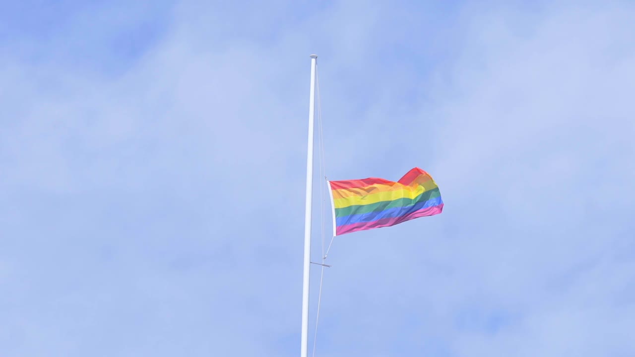 half-mast flag rainbow on the top of auckland war memorial museum