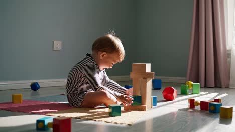 baby playing with wooden blocks