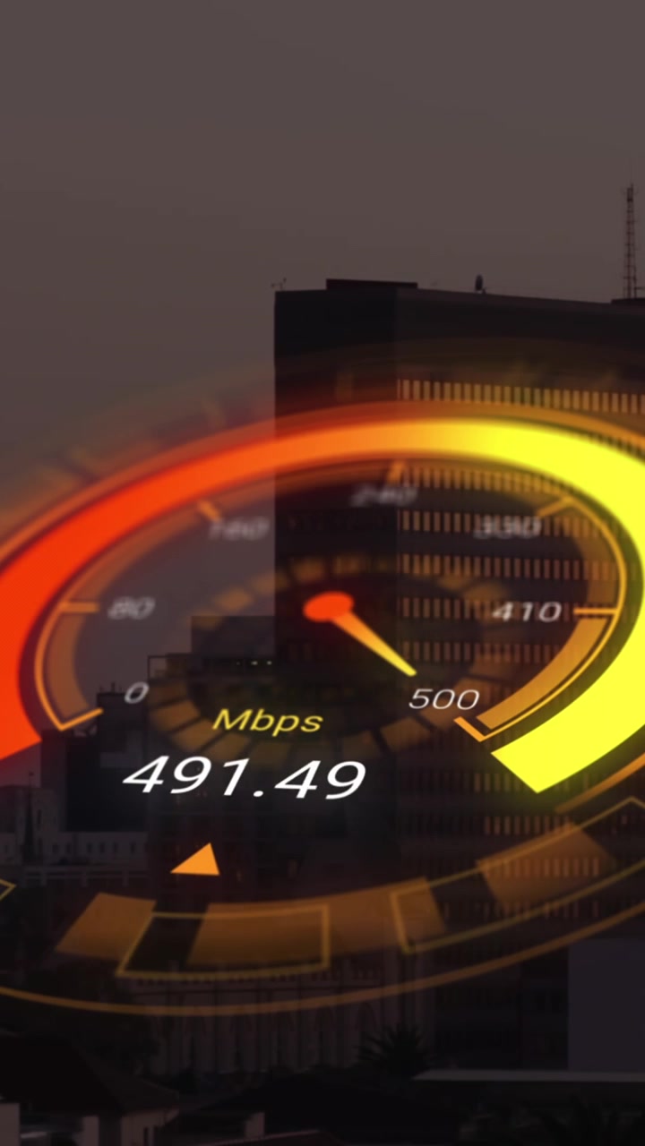 Animation of orange speedometer over cityscape