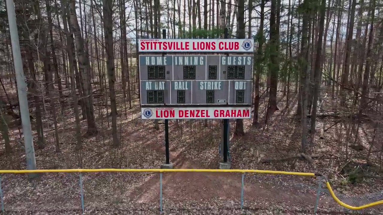 Baseball scoreboard backward drone shot in Stittsville, Ontario