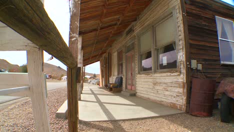 the facade of an old bar or diner sits in the mojave desert 1