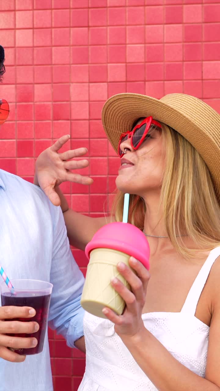 Couple enjoying summer vacation with drinks and ice cream
