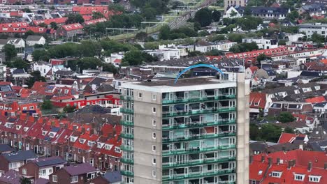 paraglider soars above zandvoort netherlands dense apartment homes along side beachfront promenade