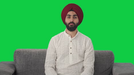 Disappointed-Sikh-Indian-man-showing-thumbs-down-Green-screen