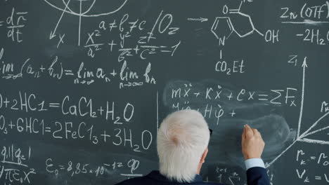 Professor Writing Equations on Blackboard