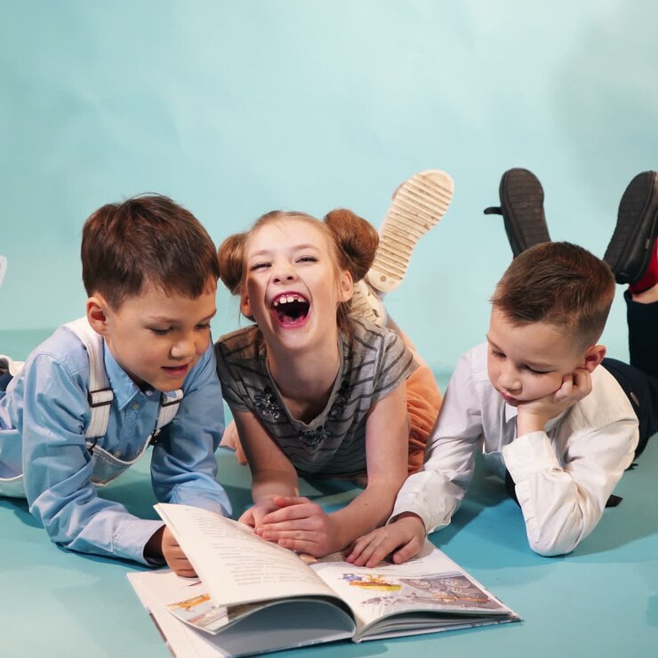 Crowd of children reading a book. Concept of a happy childhood Square video