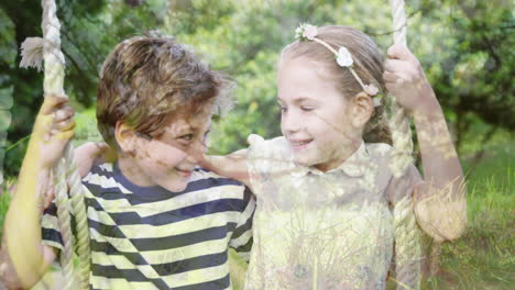 children sitting on a swing