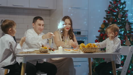 Cheerful-family-with-different-ages-holding-sparkles-celebrating-christmas.-Happy-family.-Winter-holidays.-Traditional-festive-christmas-dinner-in-multigenerational-family.-Enjoying-xmas-meal-feast.-High-quality-4k-footage