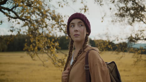 female tourist wearing knitted hat while exploring nature