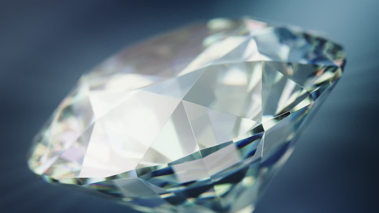 Close up of a rotating cut diamond against a blue background