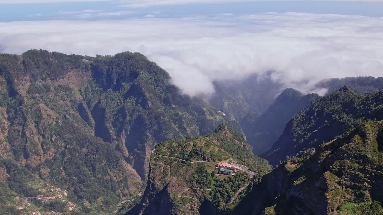 Stunning aerial view of Madeira s mountainous landscape above the clouds