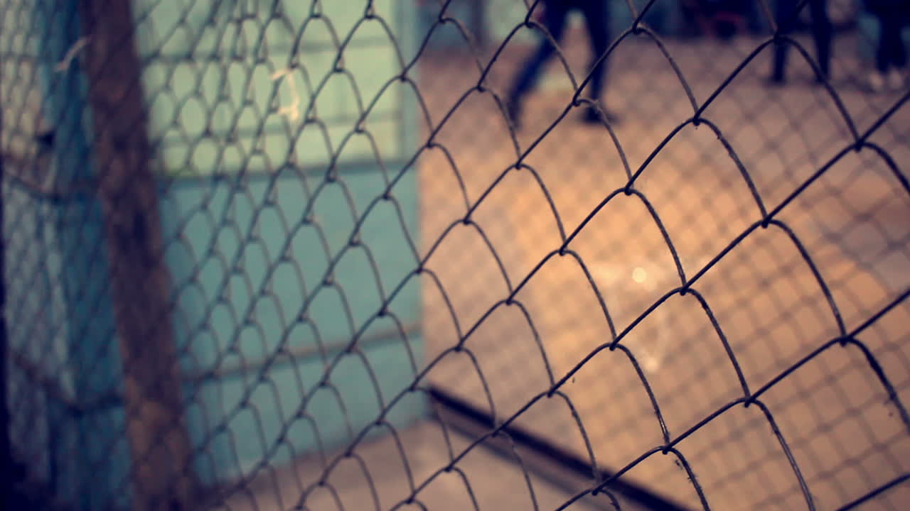 Wire fence. Closeup of steel net. Security protection barrier in shopping center