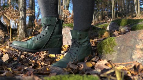 woman walking in autumn forest close up, forest protection, carbon footprint