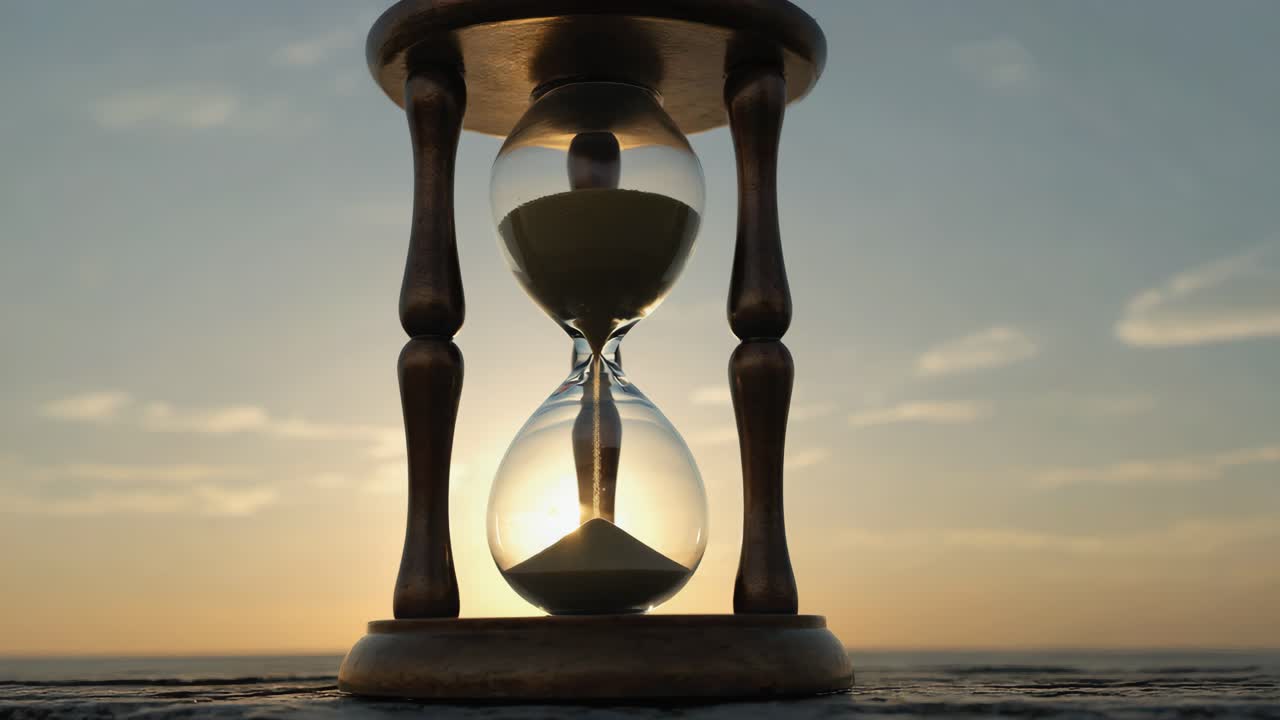 Hourglass at Sunset: A Symbol of Passing Time