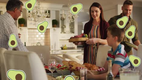 animation of avocado icons over happy caucasian family having dinner