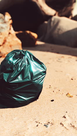 garbage bag on a sandy beach