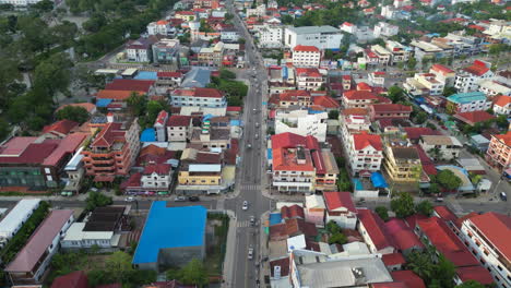 vehicles move through the wide streets of downtown siem reap cambodia