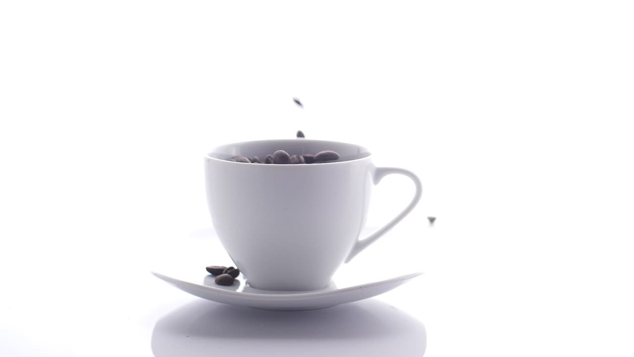 Coffee Beans Falling Into Cup