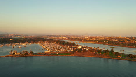 aerial of mission bay, san diego river, with skyline in distance