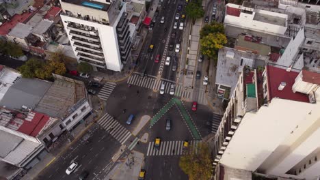 aerial view of vehicles diverting and crossing the intersection at cordoba avenue fork in buenos aires