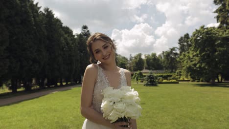 beautiful bride in a white wedding dress smiling