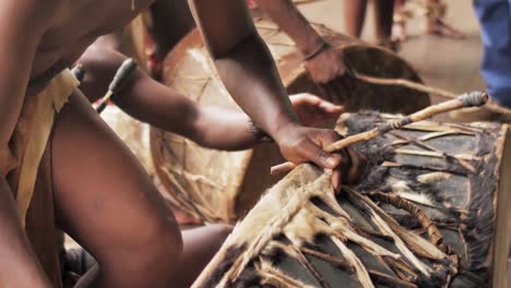 zulu warriors drumming at a traditional ceremony