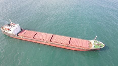 Red-Cargo-Ship-On-Sea