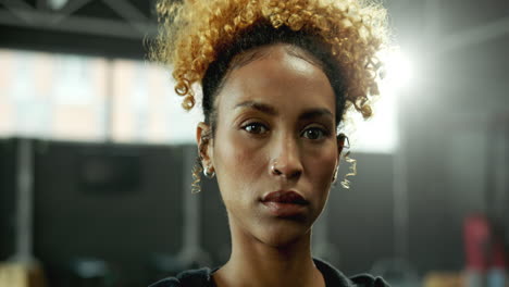 portrait of a determined woman in a gym