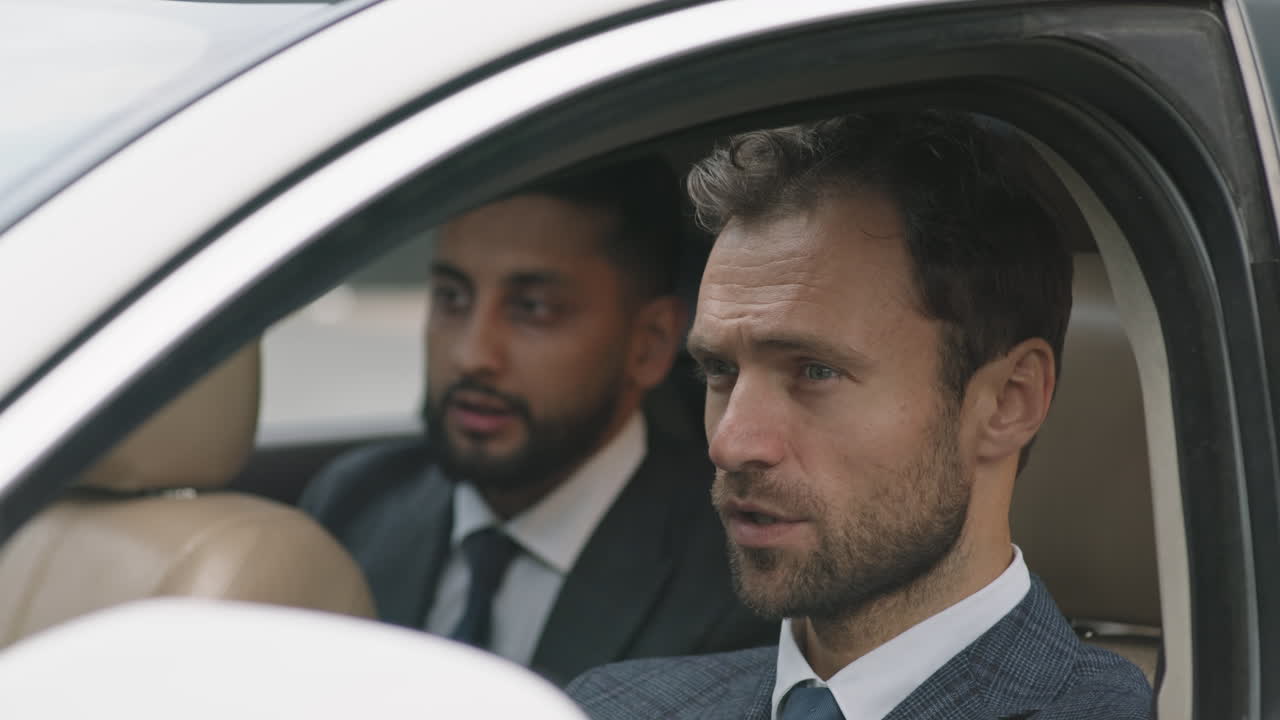 Driver Talking to Passenger in Car