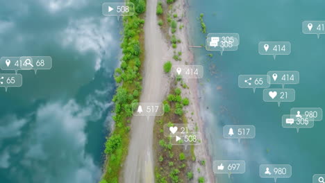 social media interaction icons animation over aerial view of coastal path