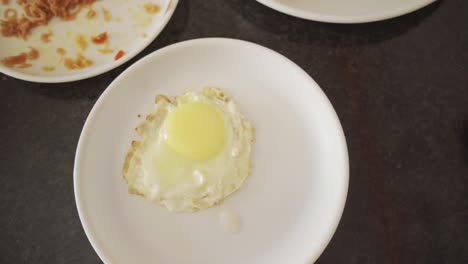 Tasty-poached-egg-top-down-view-shot,-rotating-shot,-slow-motion