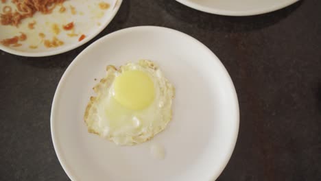 tasty poached egg top down view shot, rotating shot, slow motion