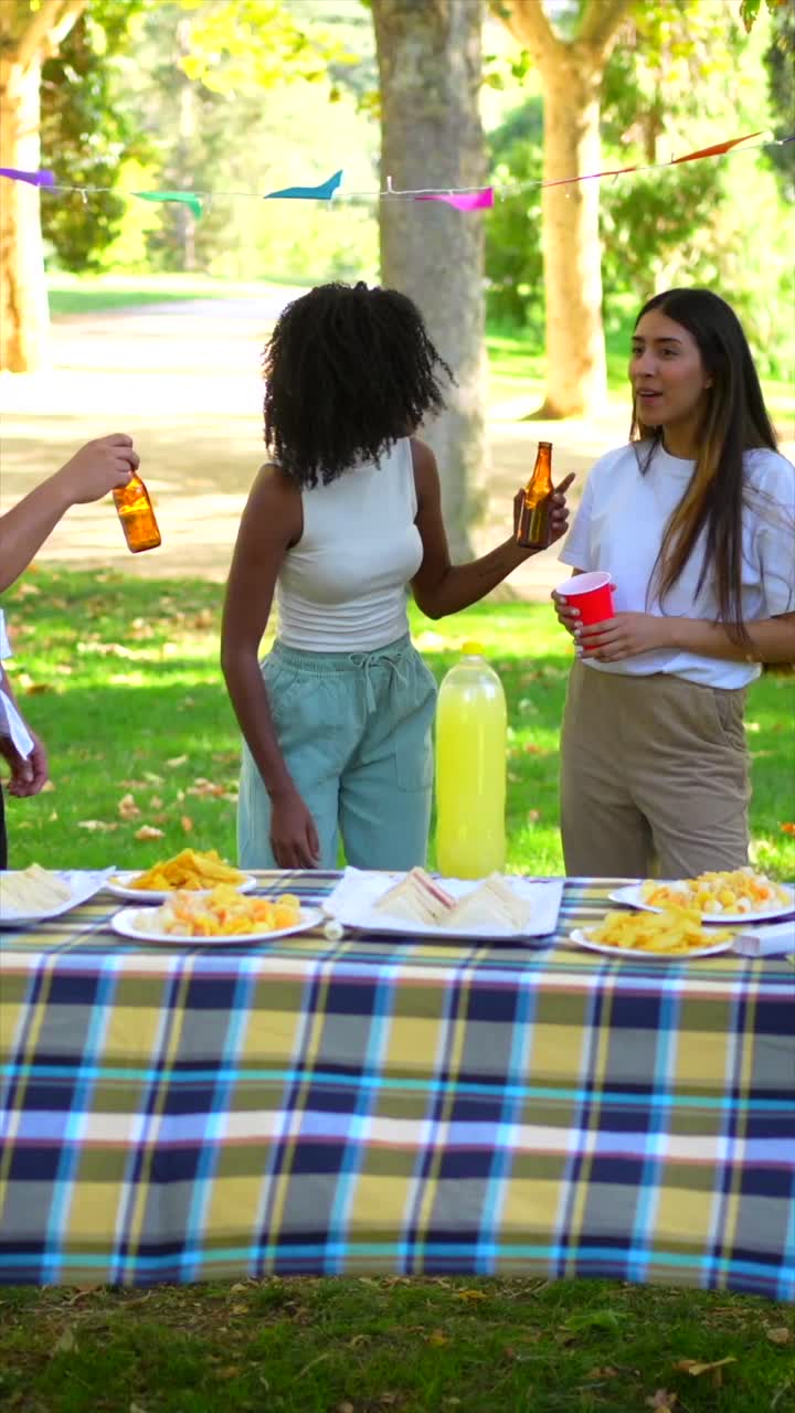 Friends enjoying a picnic party outdoors