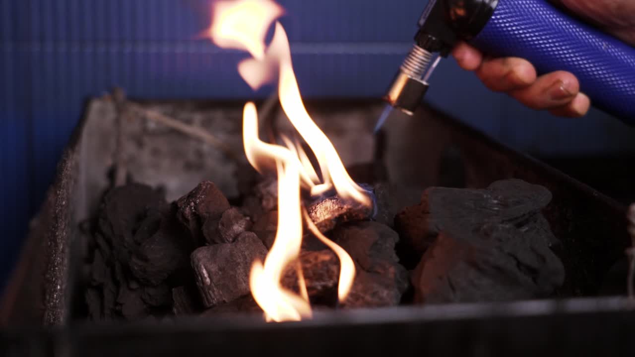 Lighting a charcoal fire for cooking